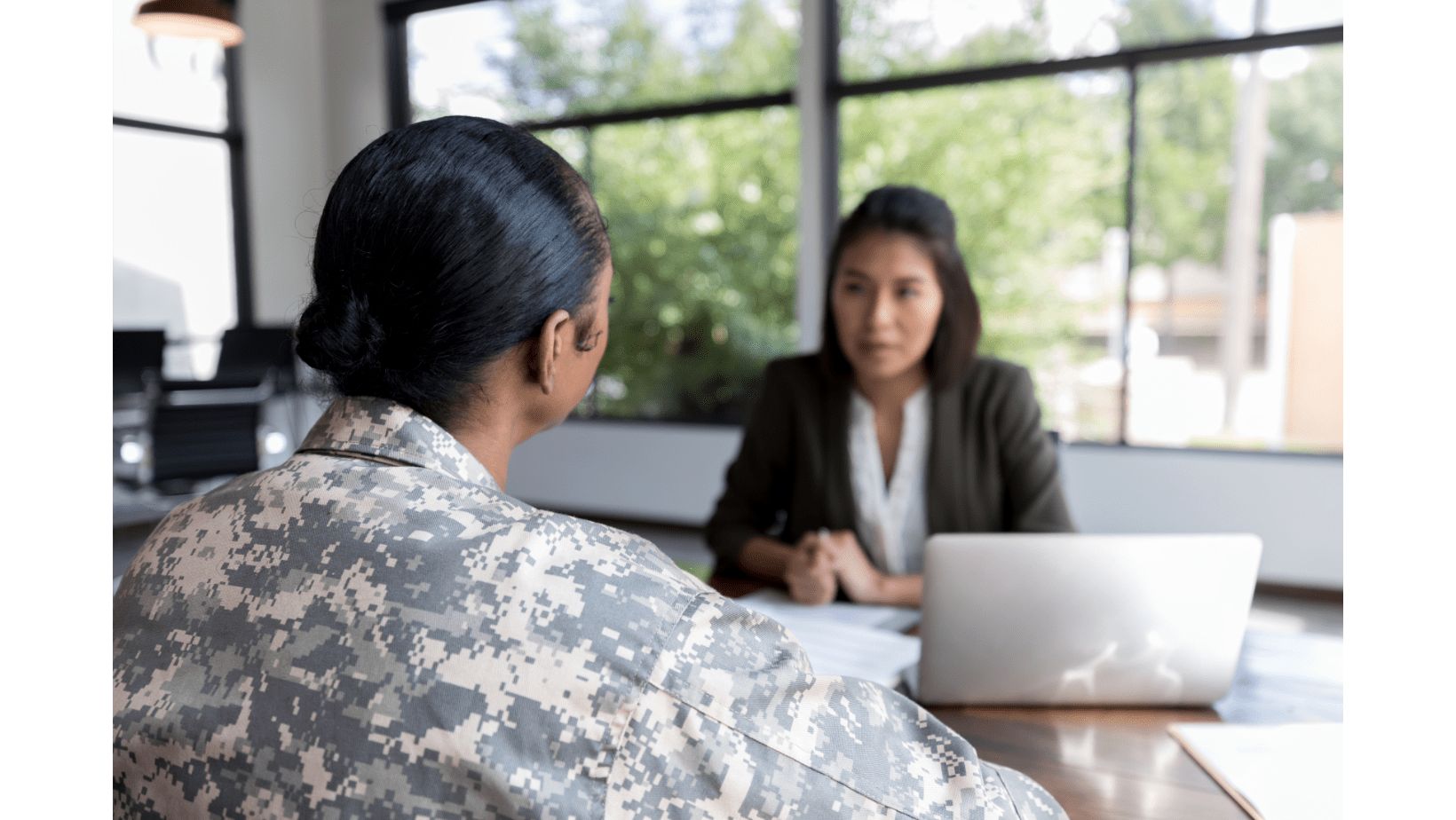 Rear view of veteran talking to woman